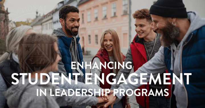 A group of young student leaders in a huddle getting ready to take on a task.